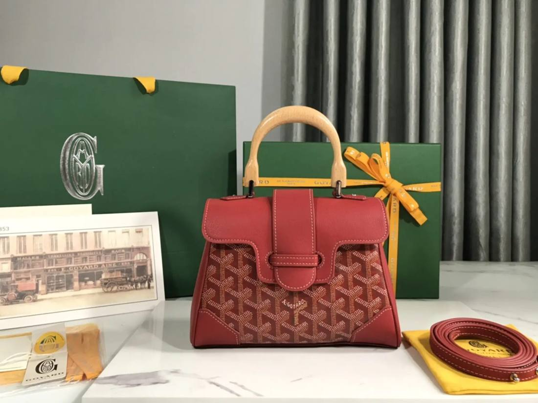 Statement handbag presented with its accessories